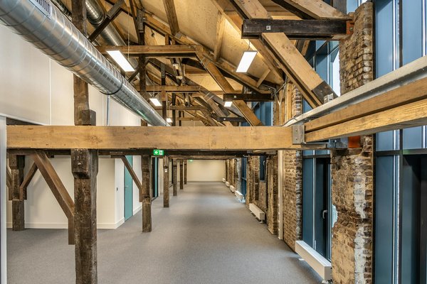 What are the best materials for insulating a UK attic to prevent heat loss in winter?